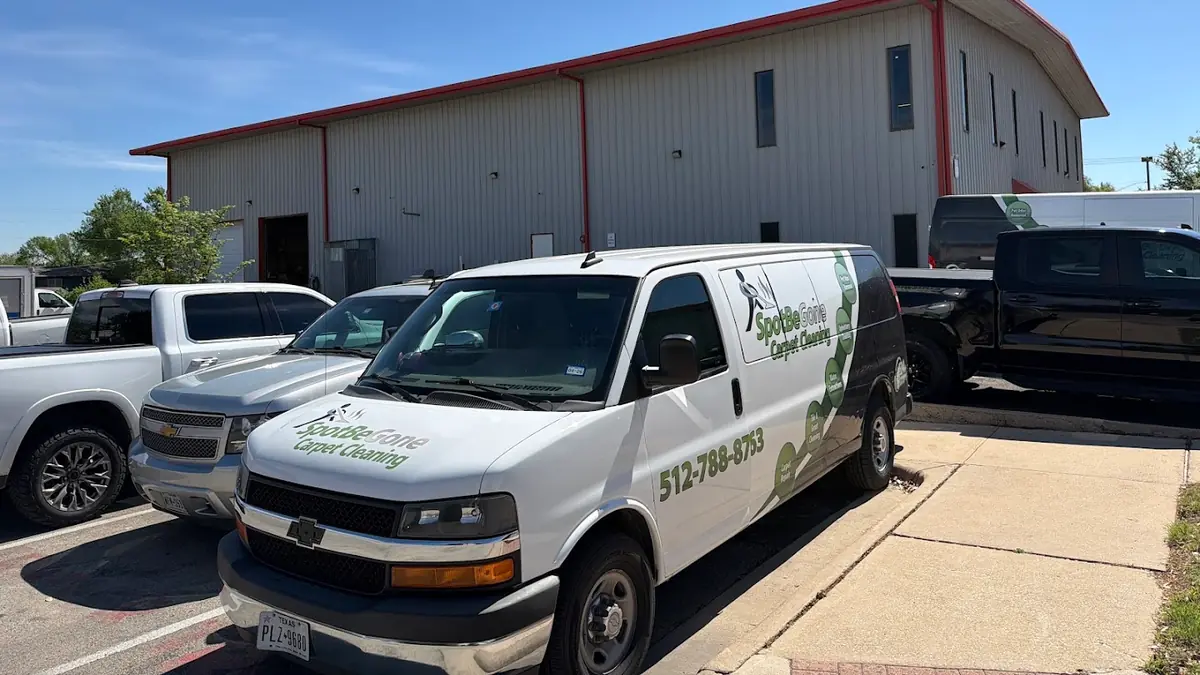 Spot Be Gone LLC vans parked outside the office