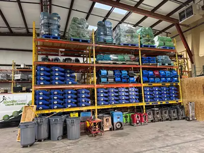 Warehouse shelving stocked with drying equipment