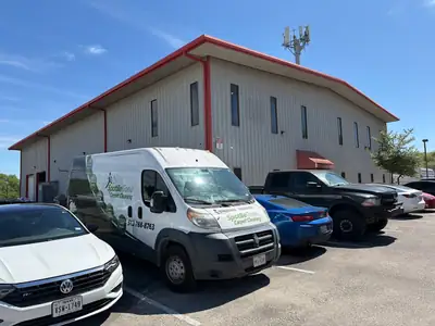 Work vans outside a building