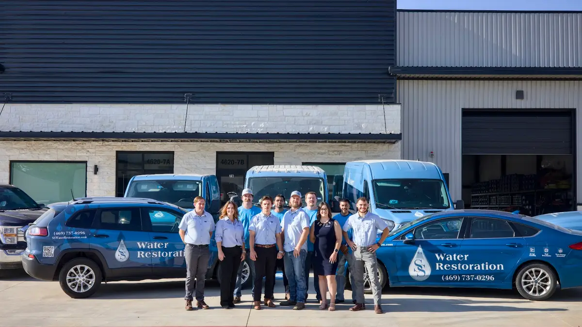 The SS Water Restoration team with branded vans