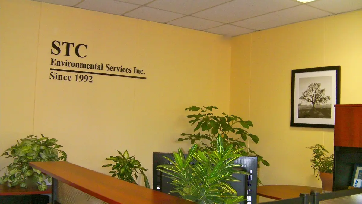 Reception area of the STC Environmental Services, Inc. office with the company name on the wall