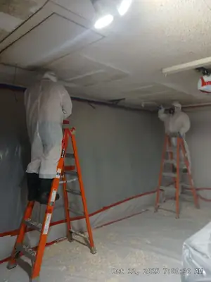 Worker on a ladder inside containment