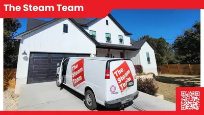 The Steam Team van parked outside a home