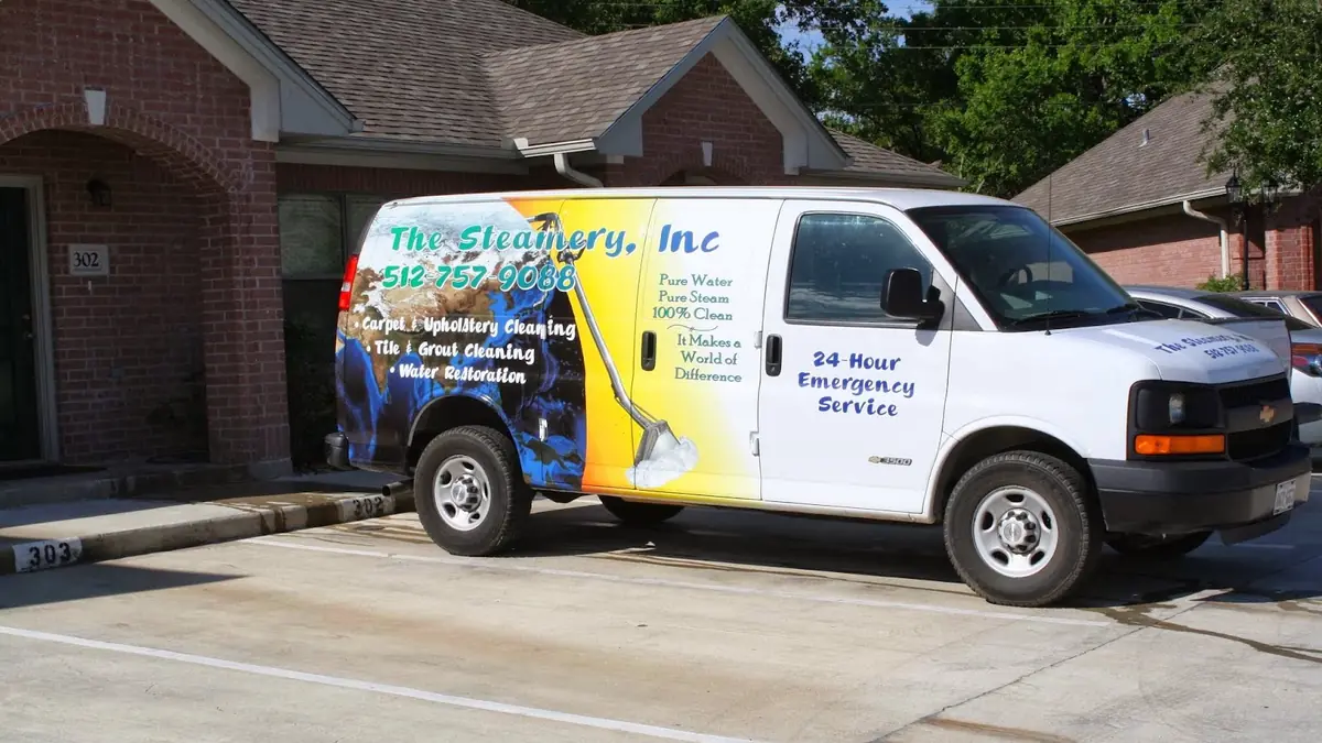 The Steamery branded van parked outside a home