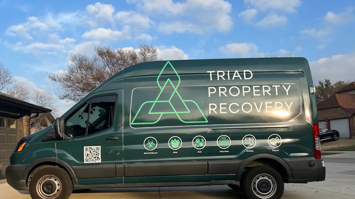 Triad Property Recovery branded green van