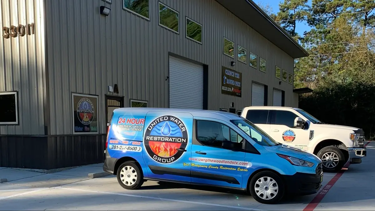 United Water Restoration vans outside a building