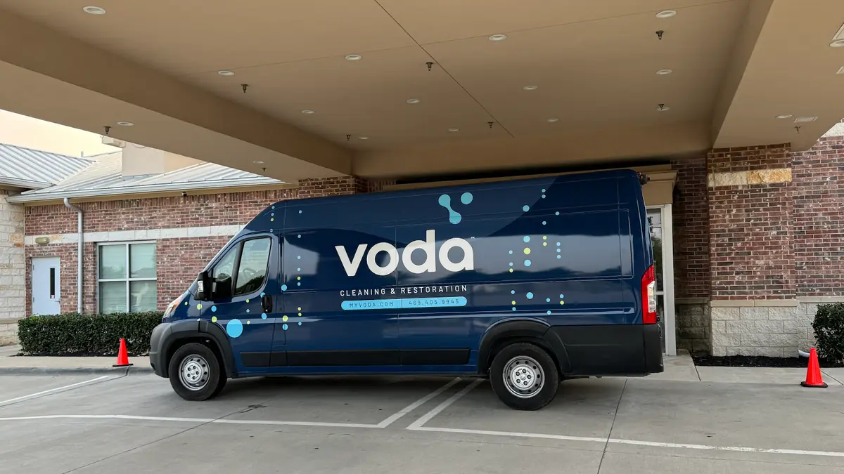 Voda branded van under a carport