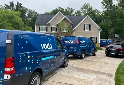 Voda vans parked on a driveway