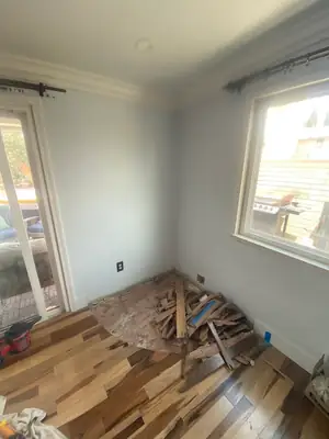 Damaged flooring by a window