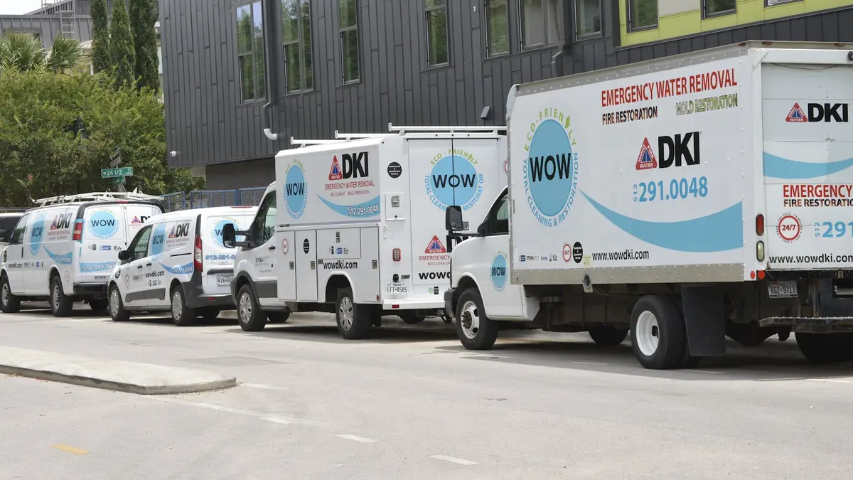 Fleet of WOW Total Cleaning & Restoration branded trucks and vans