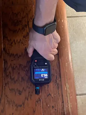 Moisture meter on wood flooring