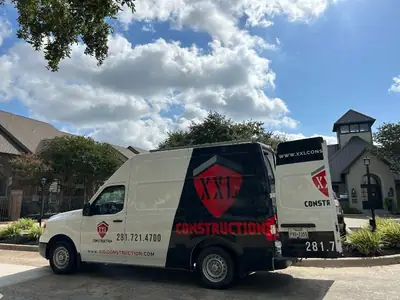 Company van parked outside a building