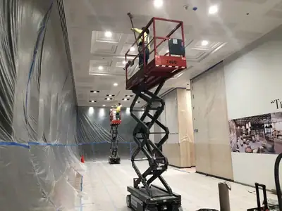 Scissor lift inside containment